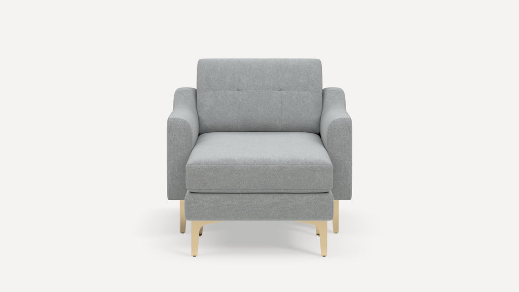 Front view of a modern light gray upholstered armchair with wooden legs against a plain white background.