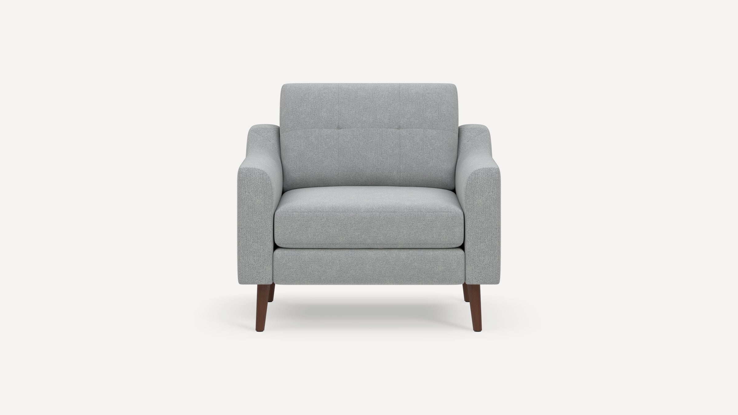 Front view of a modern light gray upholstered armchair with wooden tapered legs and padded armrests.