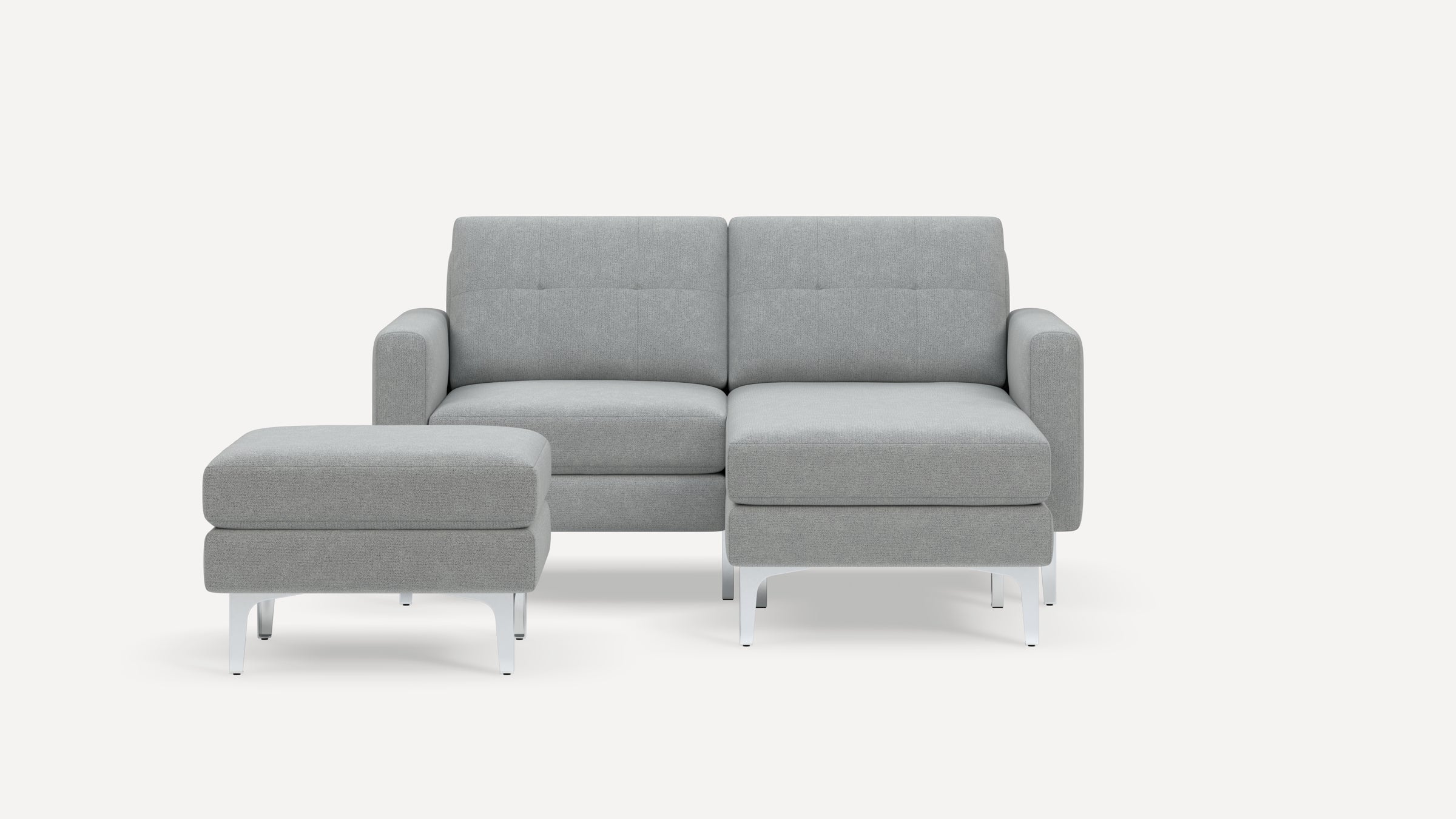 Modern light gray fabric sectional sofa with a matching ottoman, featuring clean lines and metal legs on a white background.