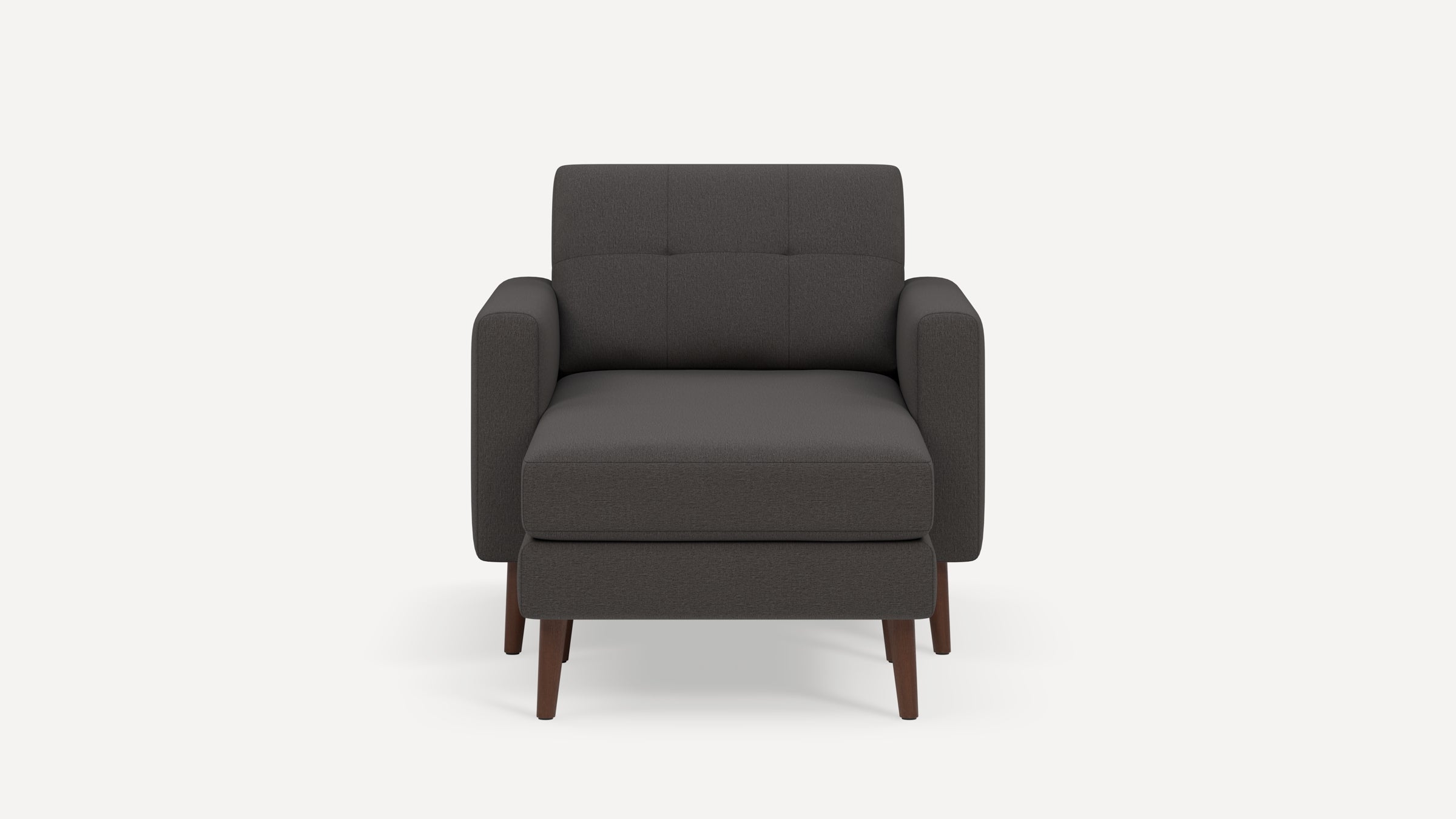 Front view of a modern dark gray upholstered armchair with wooden legs and slightly tufted backrest.