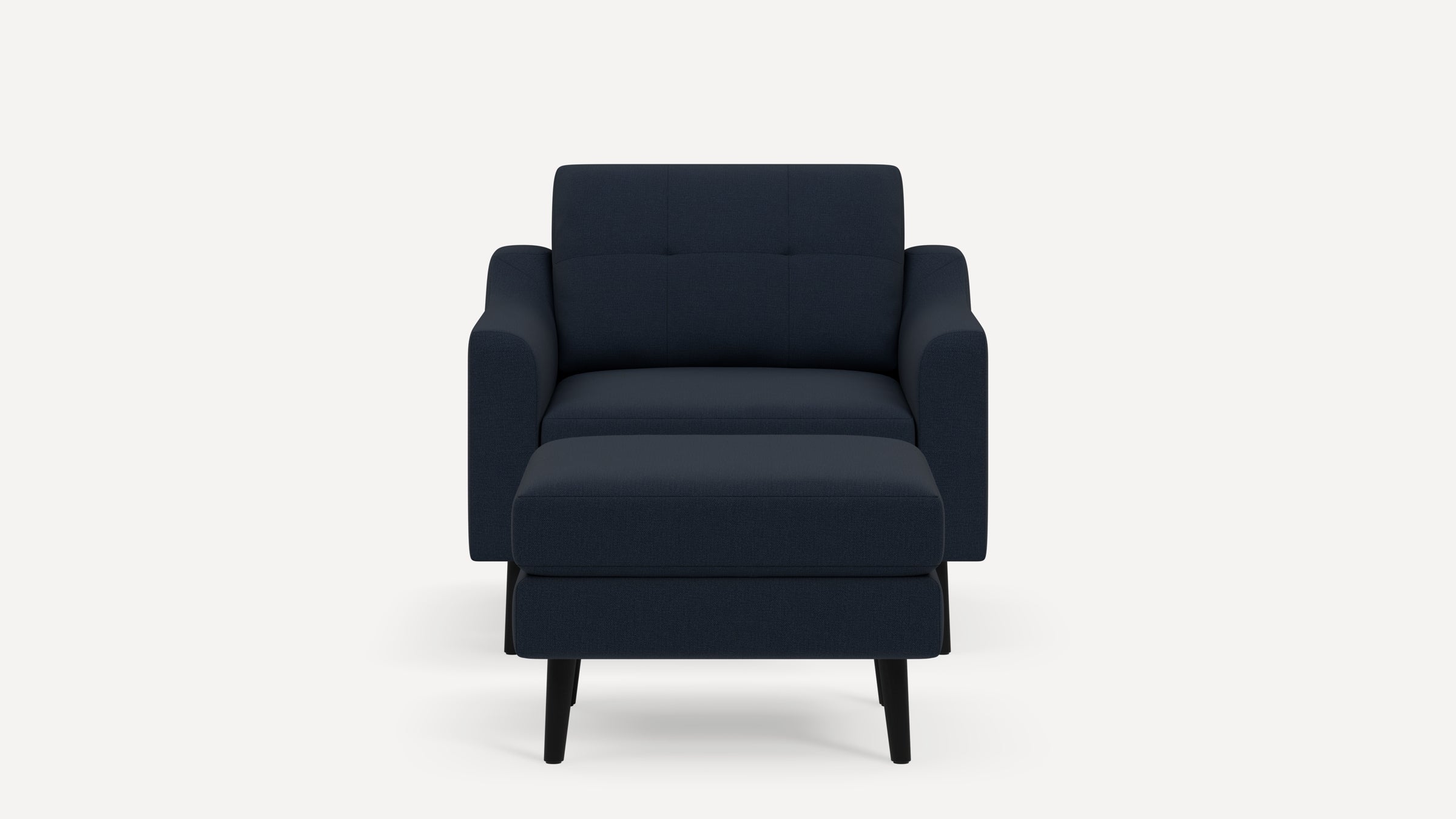 Front view of a modern dark blue upholstered armchair with matching ottoman, featuring black angled legs.