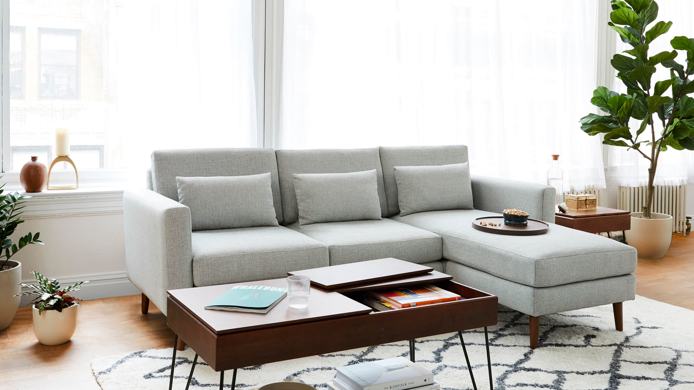 Midcentury modular Nomad sofa by Burrow in a open loft