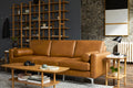 modern living room with brown leather sofa and wooden coffee table