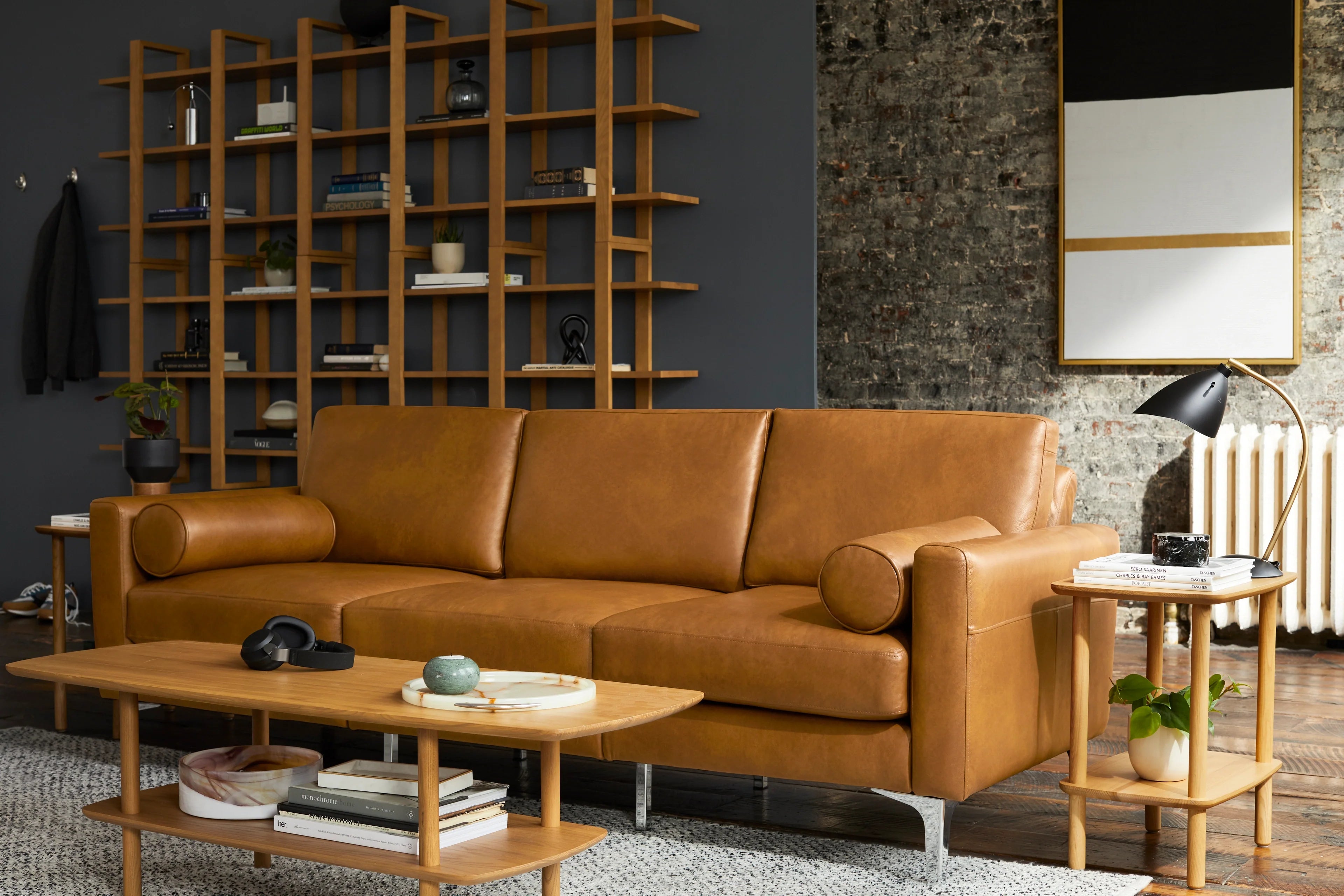 modern living room with brown leather sofa and wooden coffee table