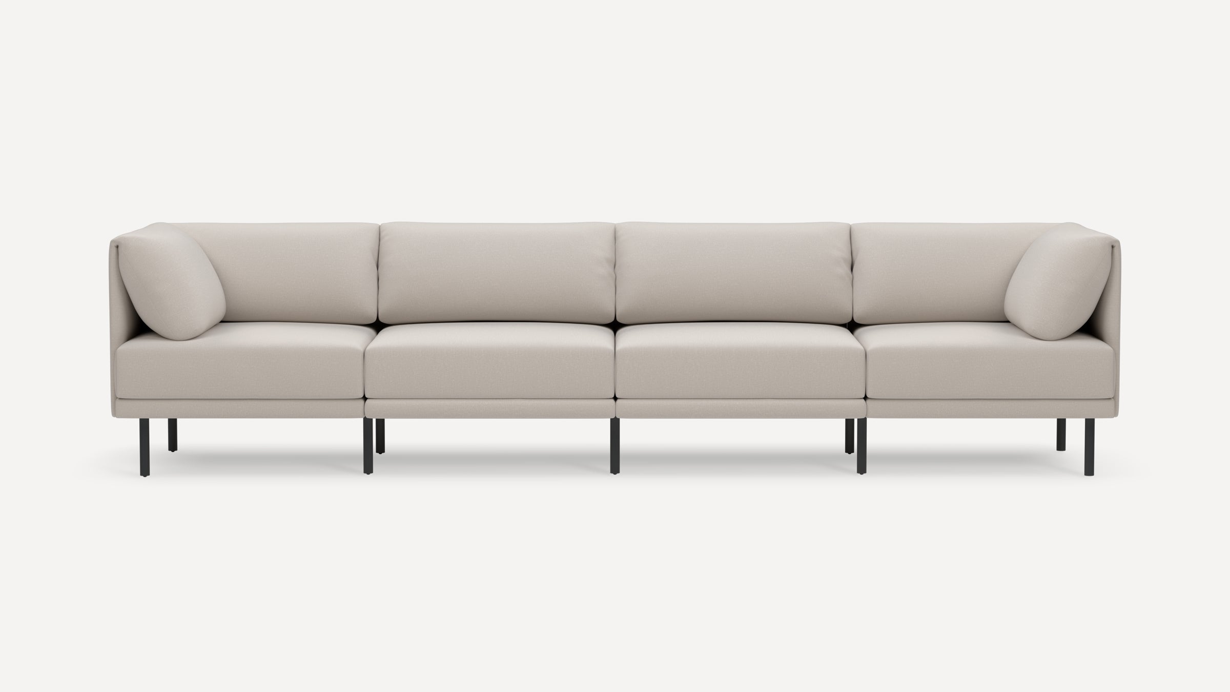 Modern beige four-seater sectional sofa with clean lines, plush cushions, and metal legs on white background.