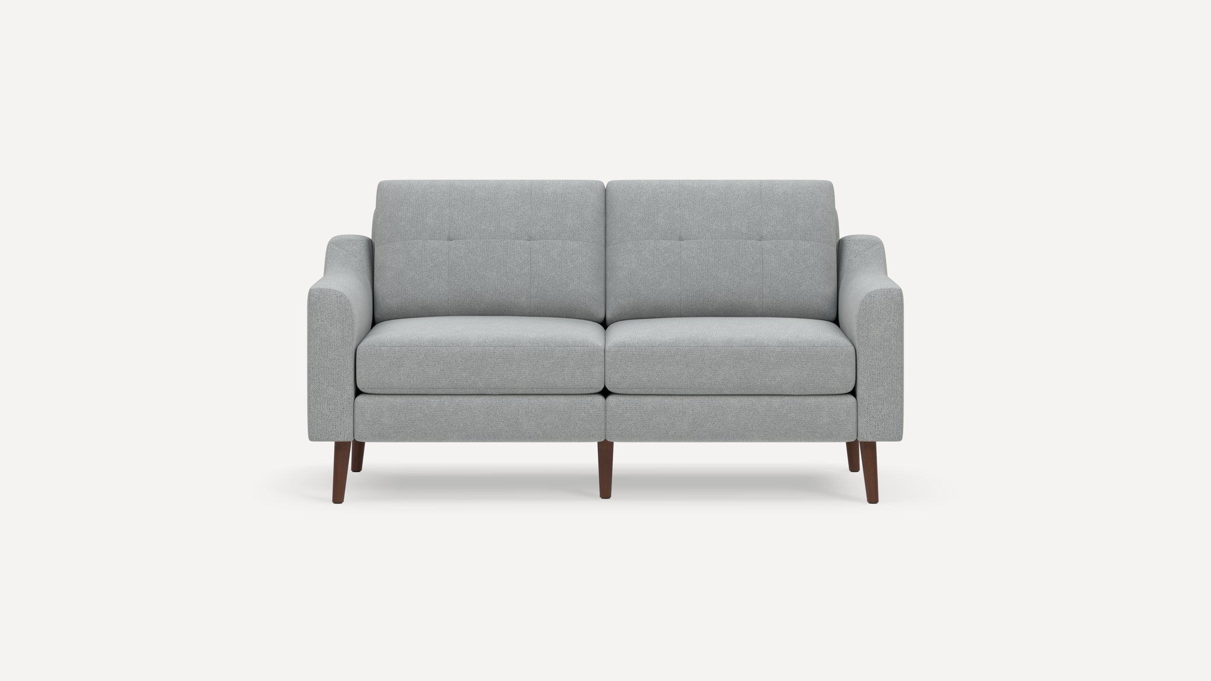 Modern light gray two-seater sofa with clean lines, button-tufted backrest, cushioned seat, and wooden tapered legs.