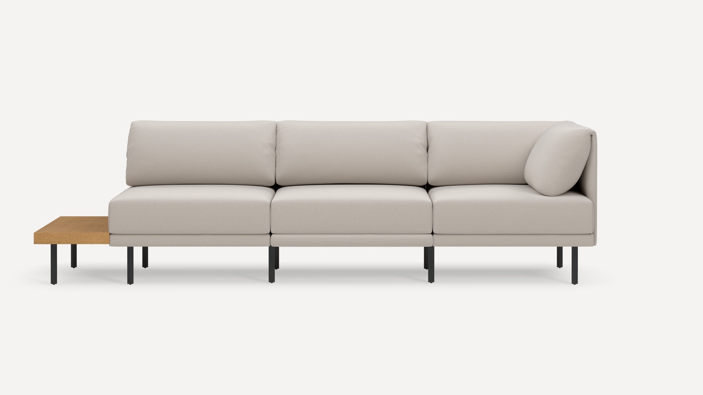Modern beige sectional sofa with clean lines, metal legs, and an attached wooden side table on a white background.