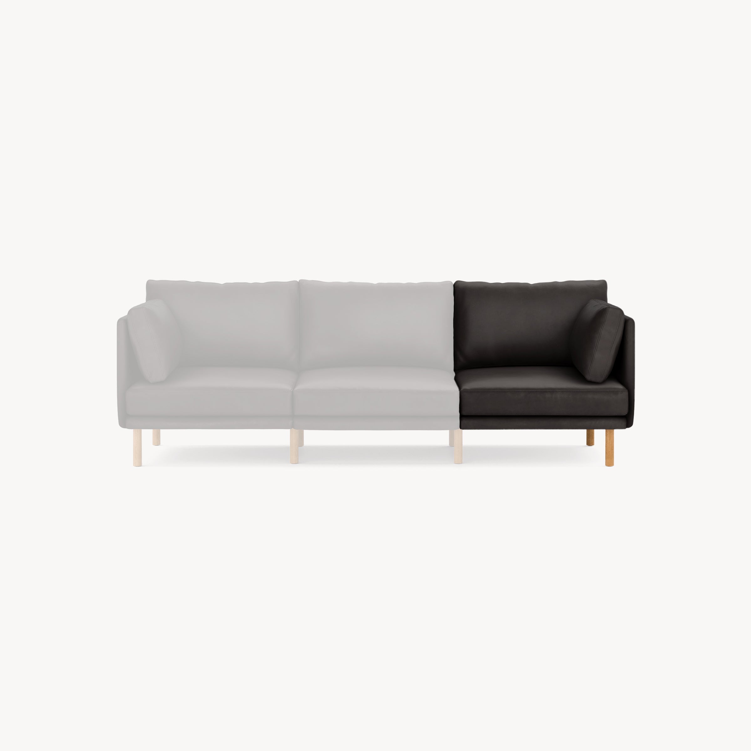 Right-side corner section of a modular sofa in black leather with wooden legs, shown against a white background.