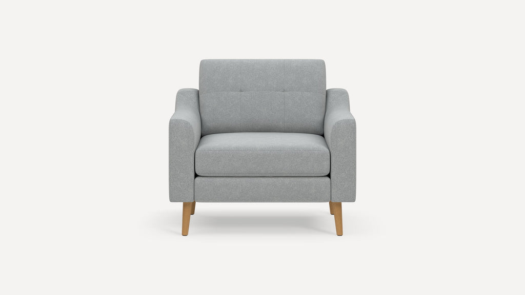 Modern light grey fabric armchair with wooden tapered legs, featuring a cushioned seat, backrest, and armrests.