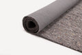 Rolled-up gray felt fabric with a textured backing, partially unrolled on a white surface.
