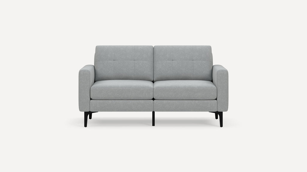 Light gray two-seater sofa with tufted back cushions, simple design, and black metal legs on a white background.