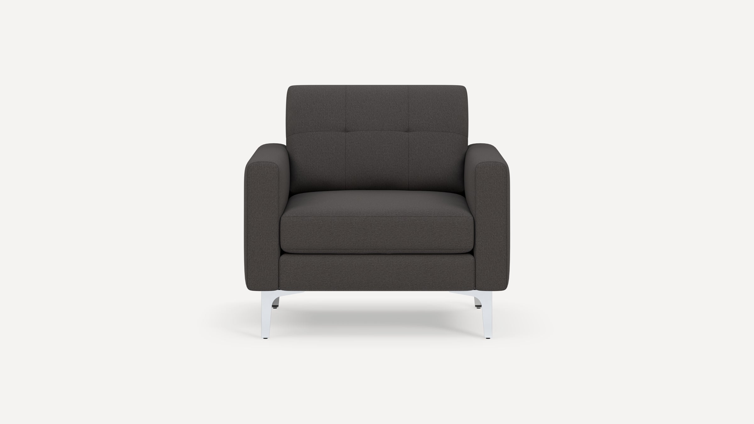 Front view of a modern dark gray fabric armchair with square tufted backrest and silver metal legs on a white background.