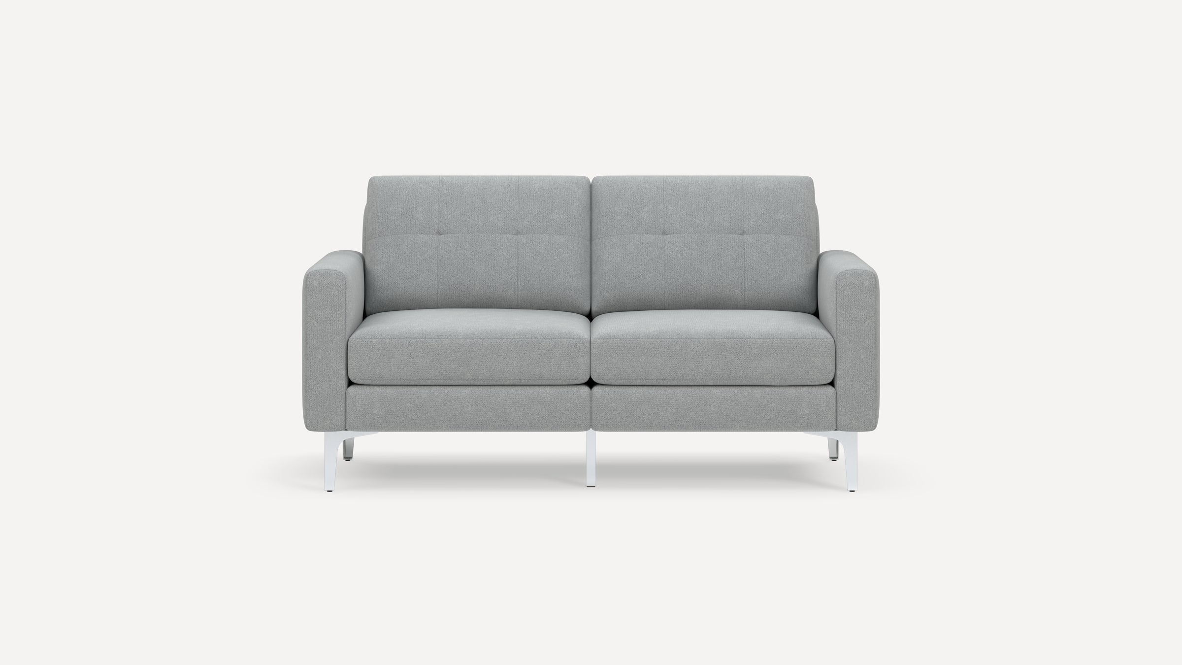 Modern light gray fabric loveseat with clean lines, tufted cushions, and white metal legs on a plain background.
