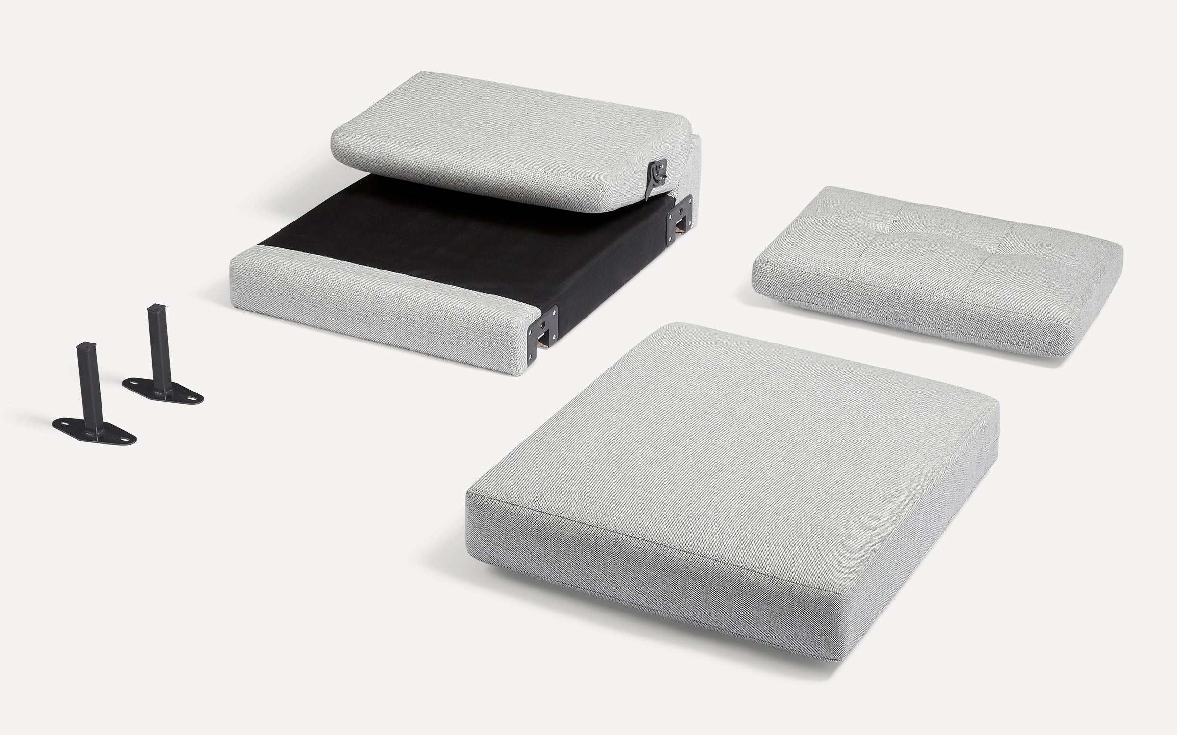 Light gray fabric chair cushions and two black metal leg brackets displayed on a white background.