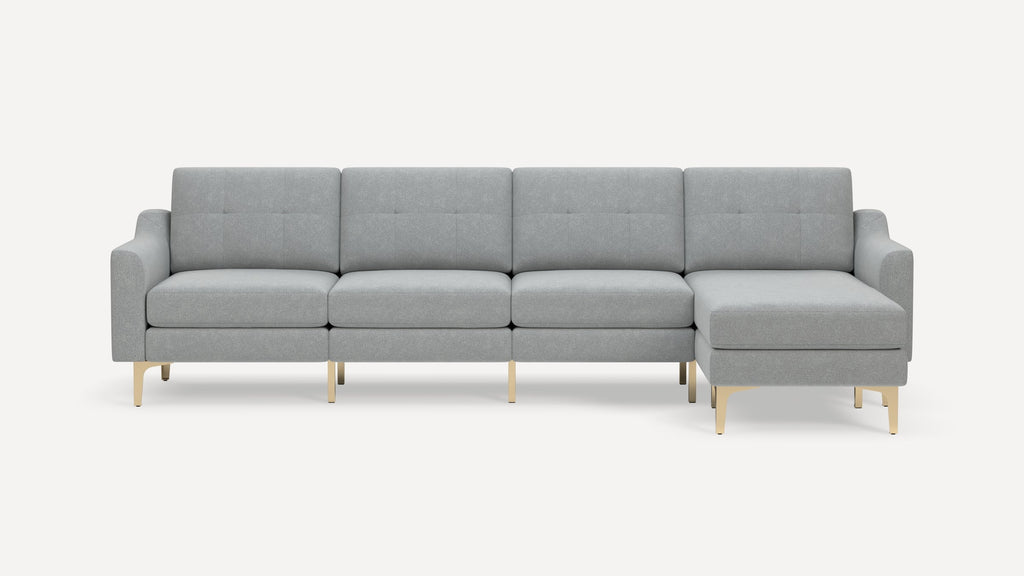 Modern light gray sectional sofa with tufted cushions, clean lines, and gold metal legs on a white background.