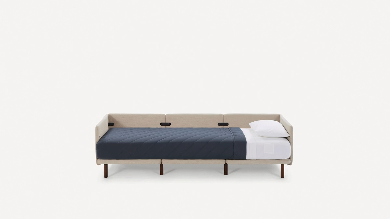 modern daybed with two pillows and a white pillow on the back