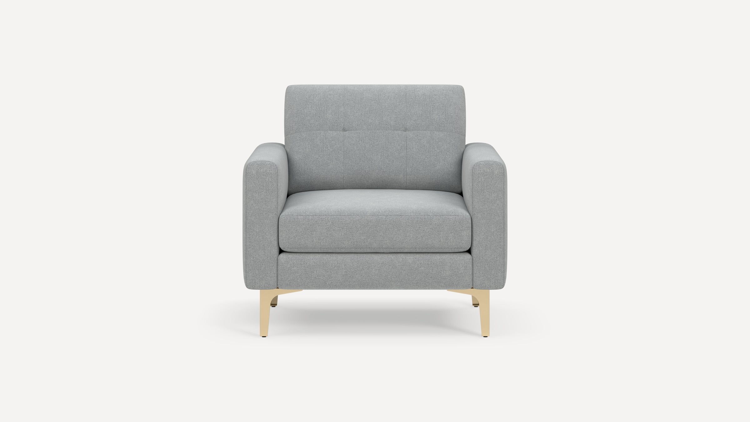 Front view of a modern light gray upholstered armchair with wide armrests and gold metal legs.