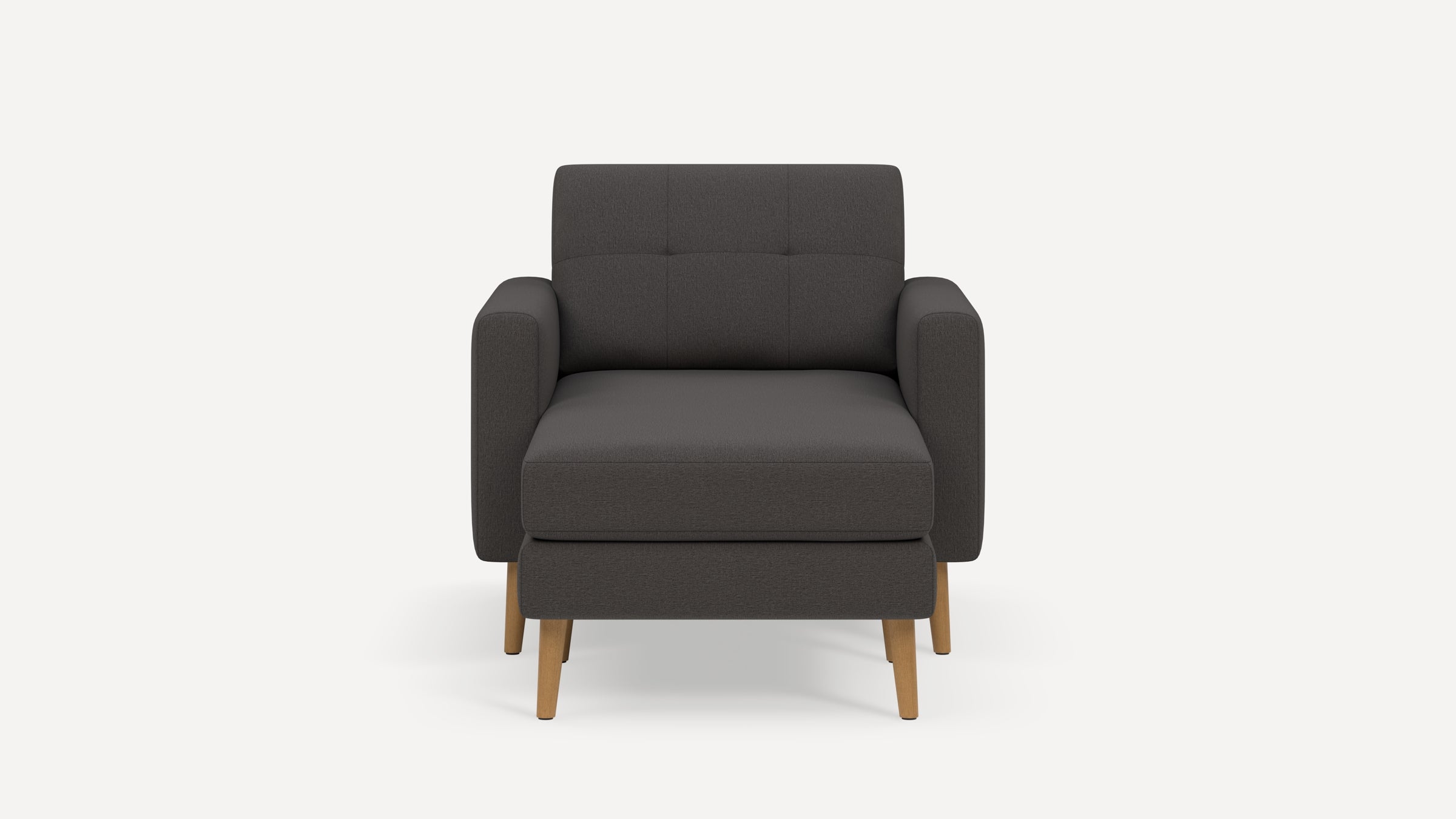 Front view of a modern dark gray upholstered armchair with wooden legs against a plain white background.