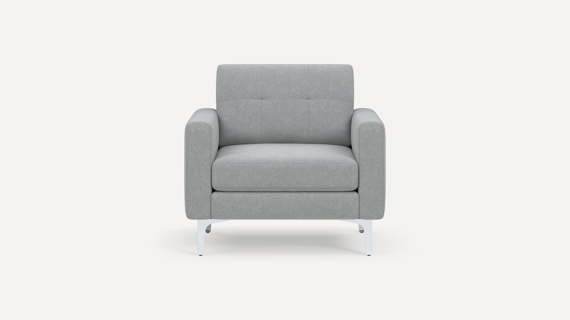Modern light gray upholstered armchair with square arms, tufted backrest, and white metal legs, front view.