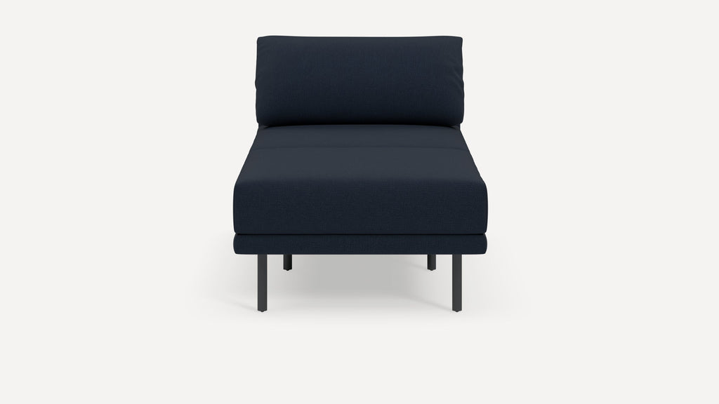 Modern armless navy blue upholstered lounge chair with clean lines and slender black metal legs on white background.
