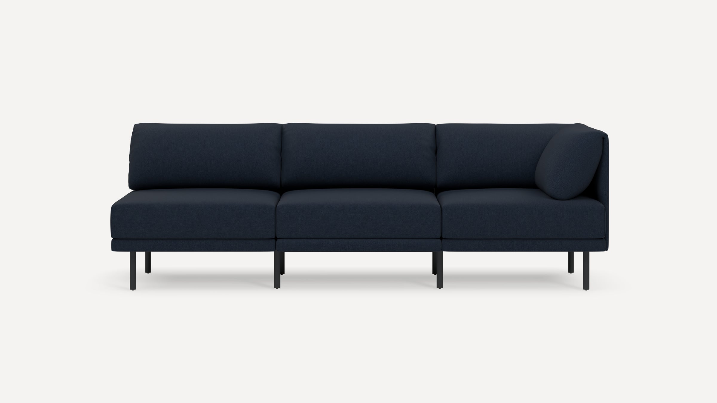 Modern three-seater navy blue sofa with black metal legs, featuring a minimalist design and clean lines, against a white background.