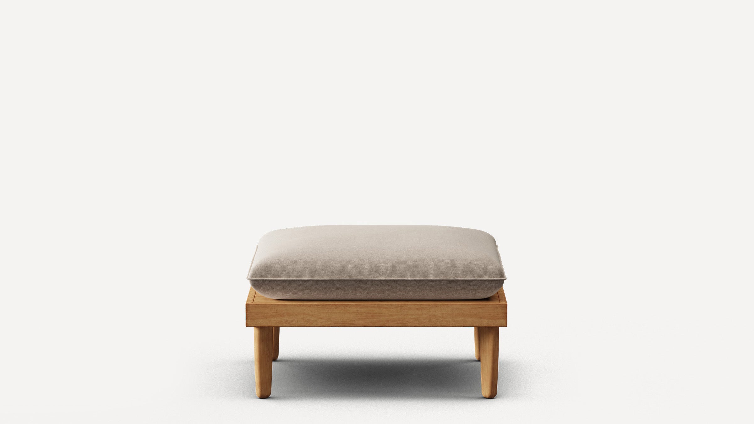 Modern wooden ottoman with beige cushioned top, four short legs, and minimalist design on plain white background.