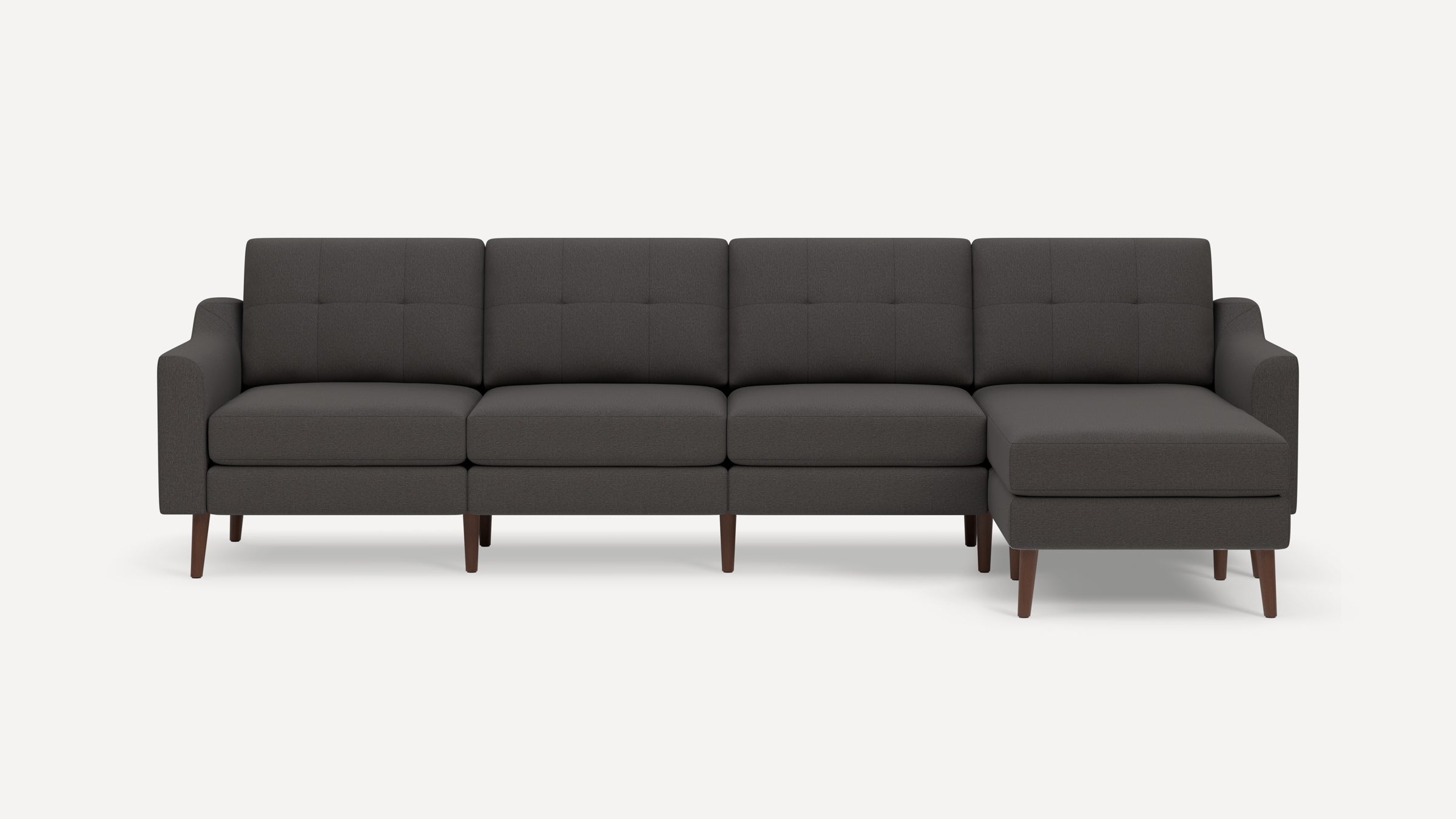 Dark gray modern sectional sofa with tufted back cushions, wooden legs, and a right-side chaise lounge.